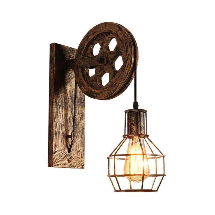 Industrial pulley wheel lamp with wooden beam, iron cage shade, and adjustable hanging height on white background