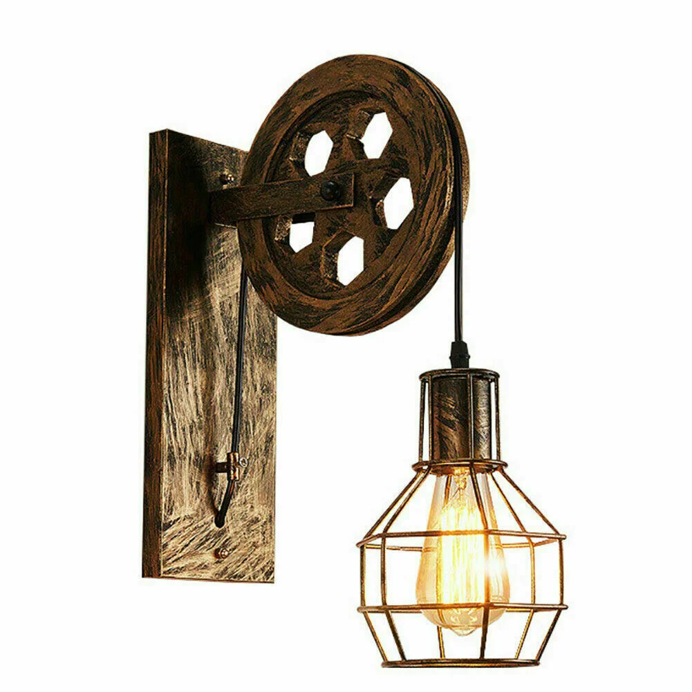 Industrial pulley wall light with wooden beam, iron cage shade, and functional pulley wheel for adjustable height lighting