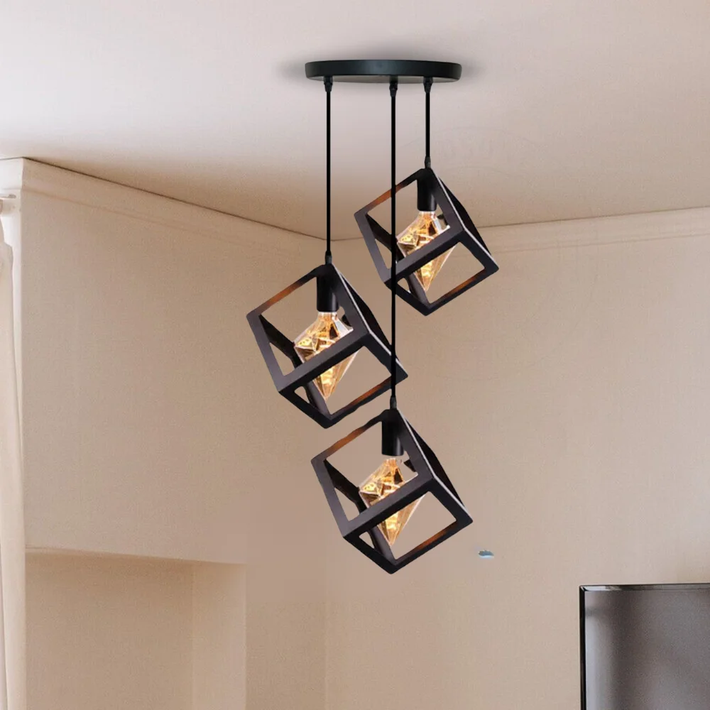 Black wire cage pendant light with three square cages and hanging cables, designed for modern industrial decor