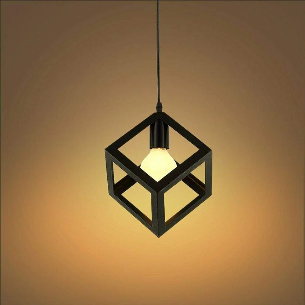 Black 3 head wire cage pendant light hanging over a kitchen island, modern kitchen island lighting style, angled base and hood