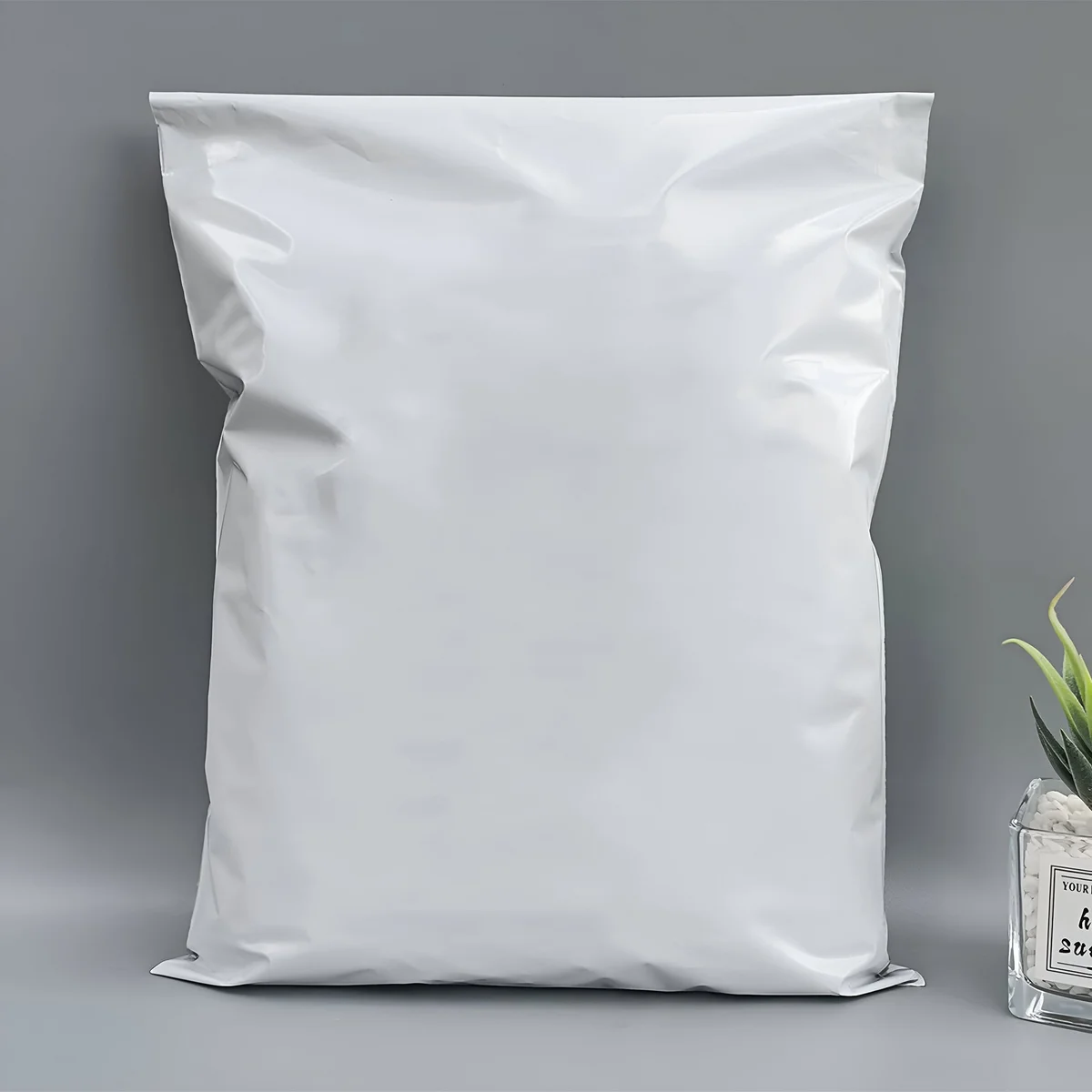 Stack of 17x30 cm self-adhesive mailing bags made from strong, waterproof polyethylene material with peel and seal closure