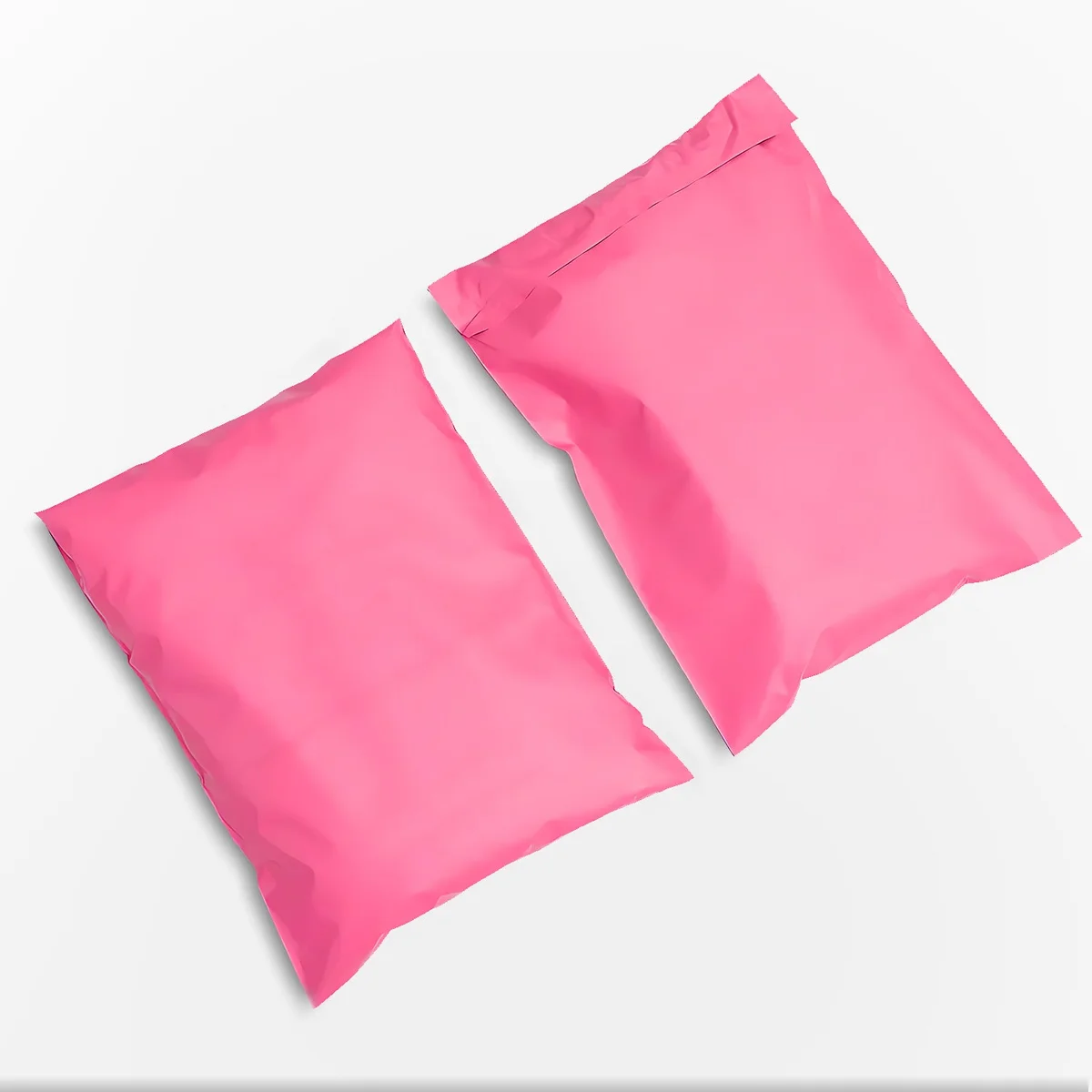 Stack of pink, light green, and cyan blue polyethylene mail bags with self-adhesive closures, 28x42cm size