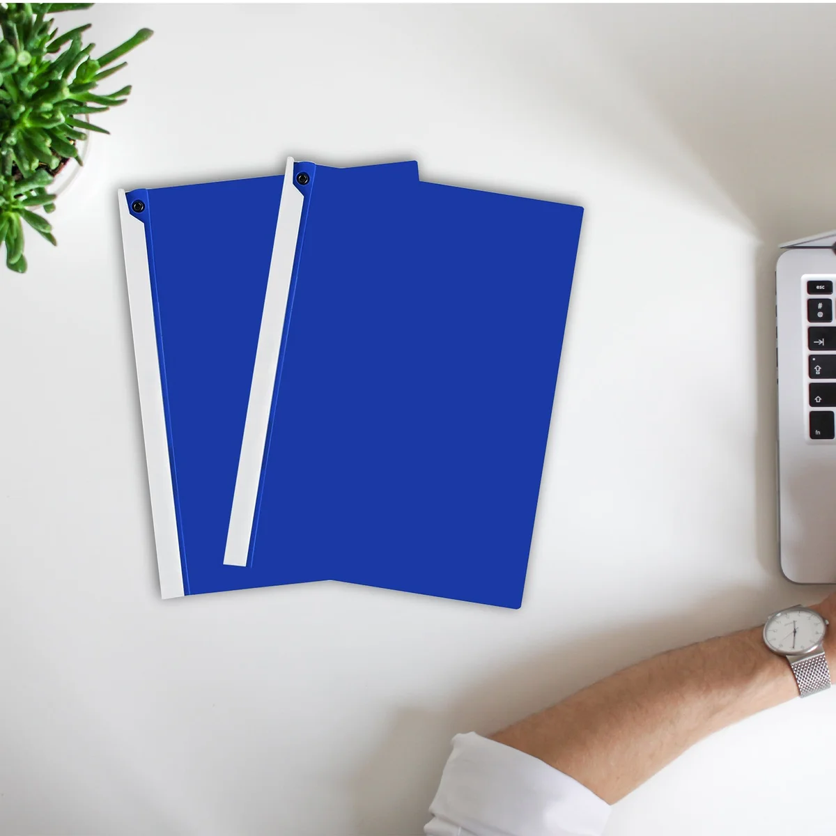 Six A4 rotating lever report folders in assorted colors stacked, showing durable polypropylene material and blunt corners