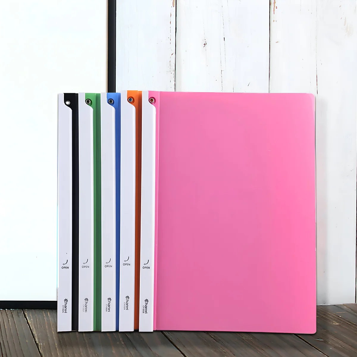 Six A4 rotating file folders in assorted colors made of durable polypropylene with rotating lever and blunt corners stacked together