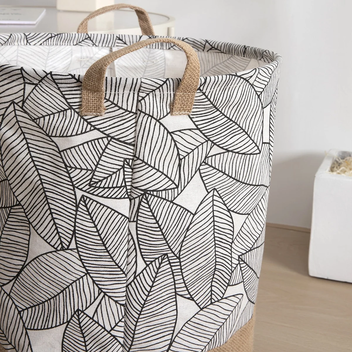 Foldable black and white grid laundry bag cotton with waterproof lining, standing upright for dirty clothes storage