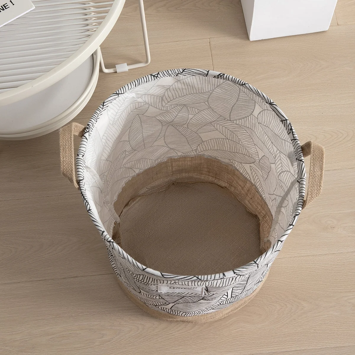 Lightweight foldable basket with black and white grid pattern, cotton material, standing upright for laundry storage