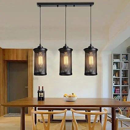 3 head ceiling pendant light with three metal cage shades hanging from adjustable cables on ceiling plate