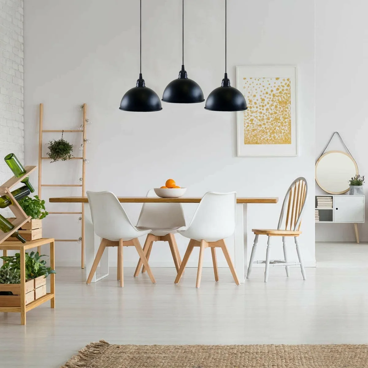 Industrial pendant light with three black metal dome shades hanging from adjustable cables on a rectangular ceiling plate