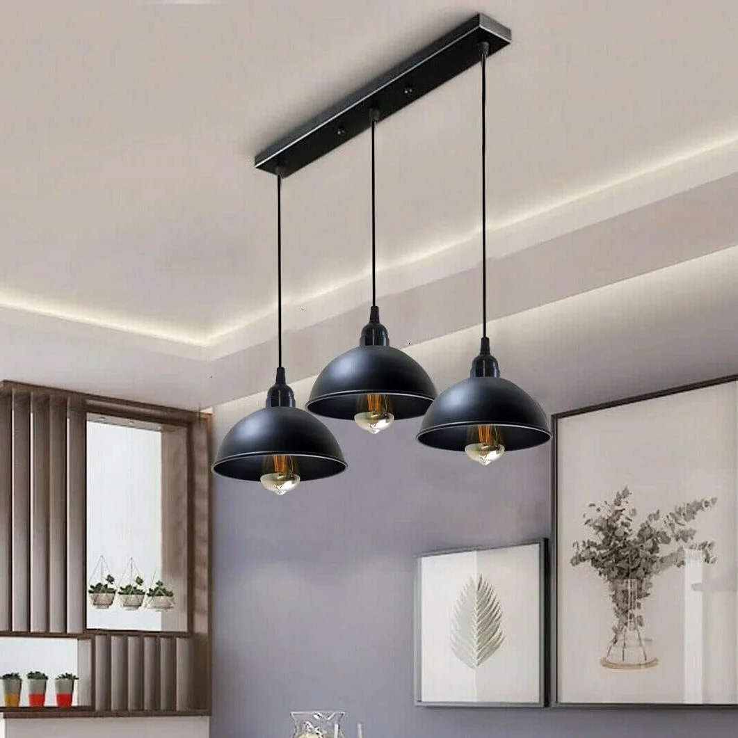 Black industrial 3 way pendant light with three adjustable metal dome shades and a rectangular ceiling plate