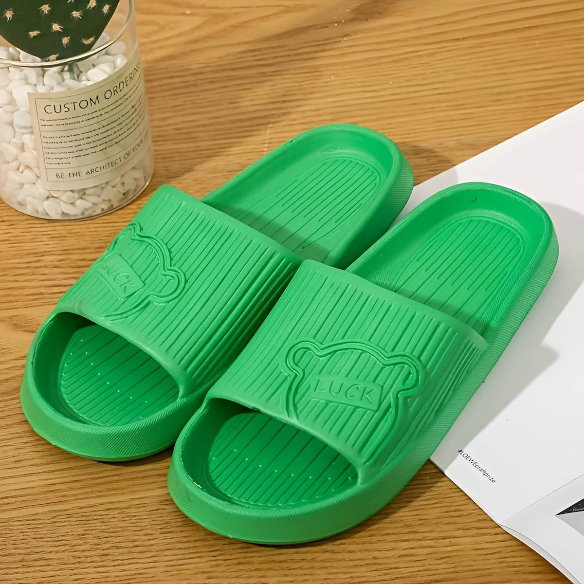 Pair of black anti slip shower sandals with ergonomic design and cushioned EVA sole for men and women
