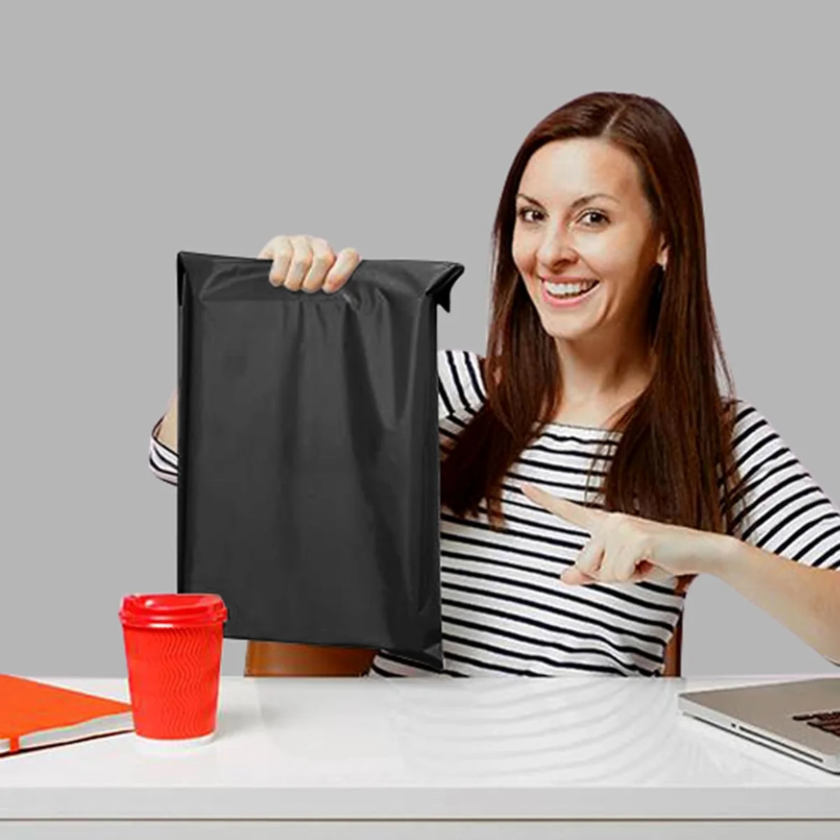 Stack of large 55x70cm polyethylene polymailer bags with strong self-adhesive seal for secure mailing