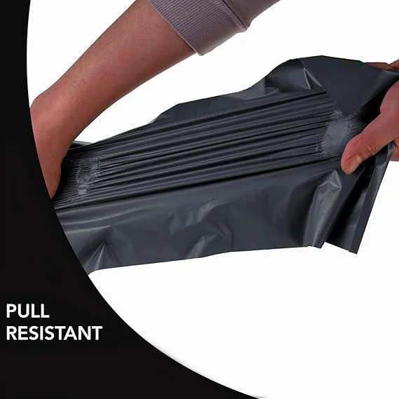 Stack of large black polyethylene mailing bags, 40x55cm, showing self-adhesive seal and waterproof material features
