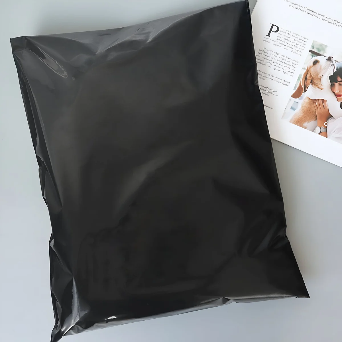 Stack of strong durable postage bags made from tear-resistant, waterproof polyethylene with self-adhesive closure