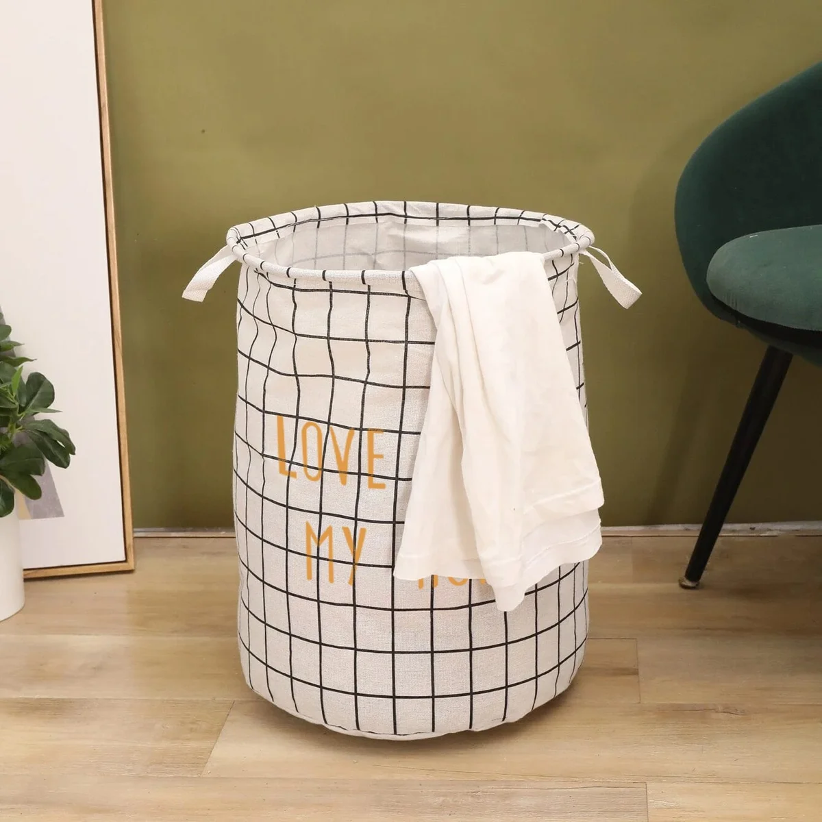Two large black and white foldable waterproof laundry baskets made of cotton with handles, shown empty on a white background