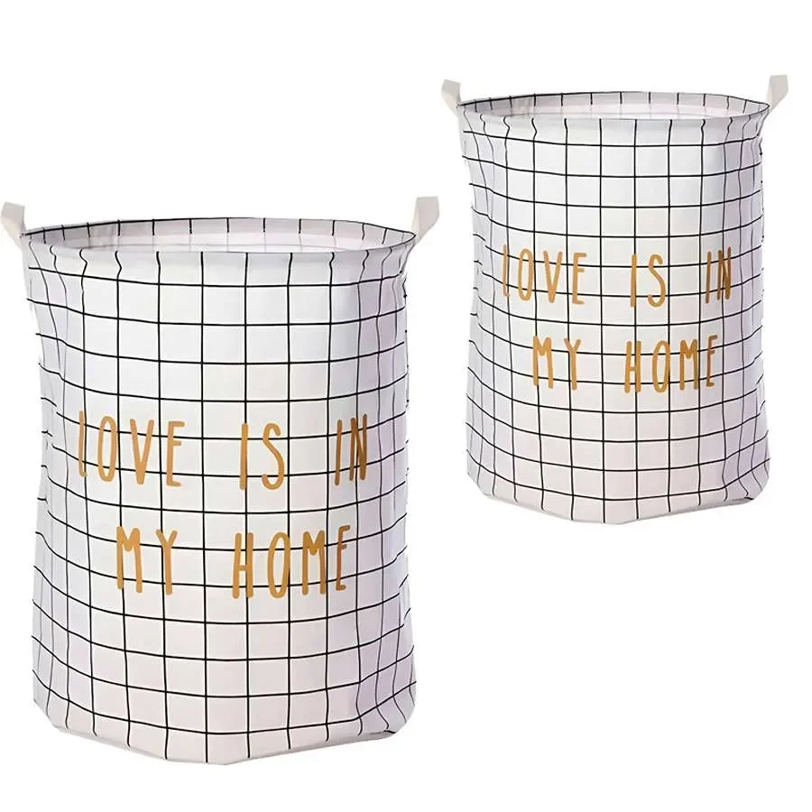 Two large laundry bags in black and white cotton with foldable design and waterproof inner layer shown side by side