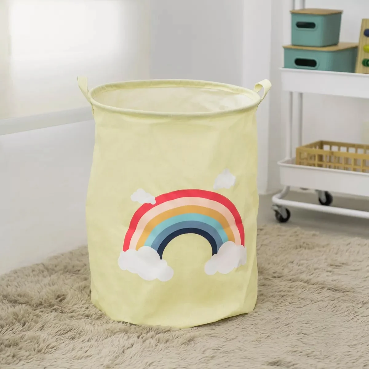 Two foldable round kids laundry baskets with zebra face pattern in yellow, gray, and white, made of cotton with waterproof lining