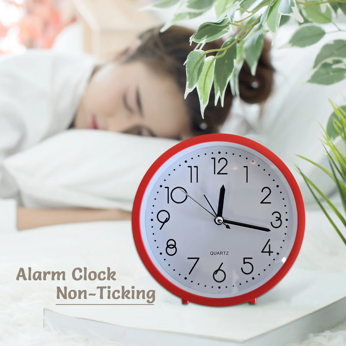 Vintage style clock with bold white numerals, round black frame, and soft eye-care night light on a wooden table