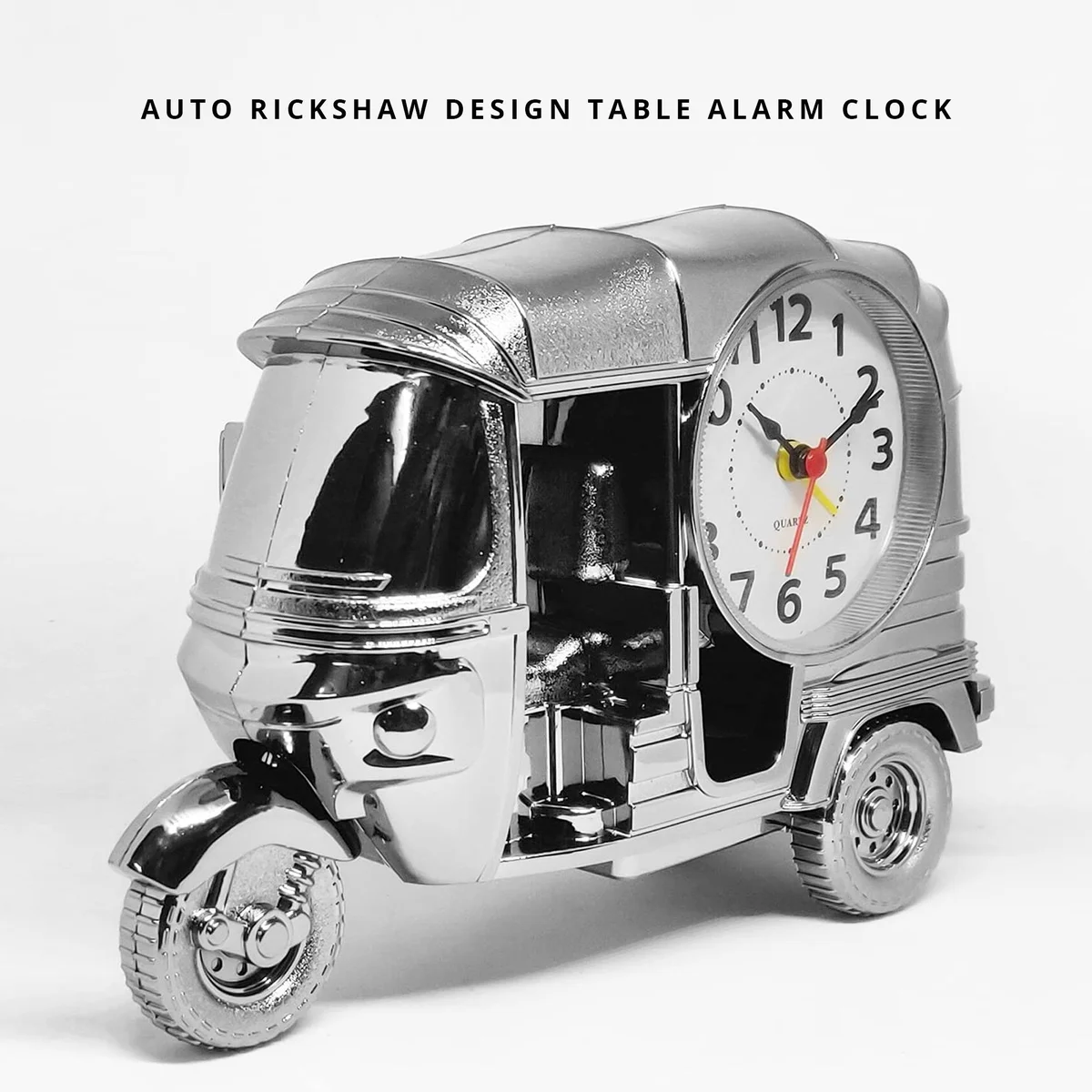 Modern three-wheeler shaped analogue alarm clock in plastic, ideal for desk or bedroom decoration and gifting