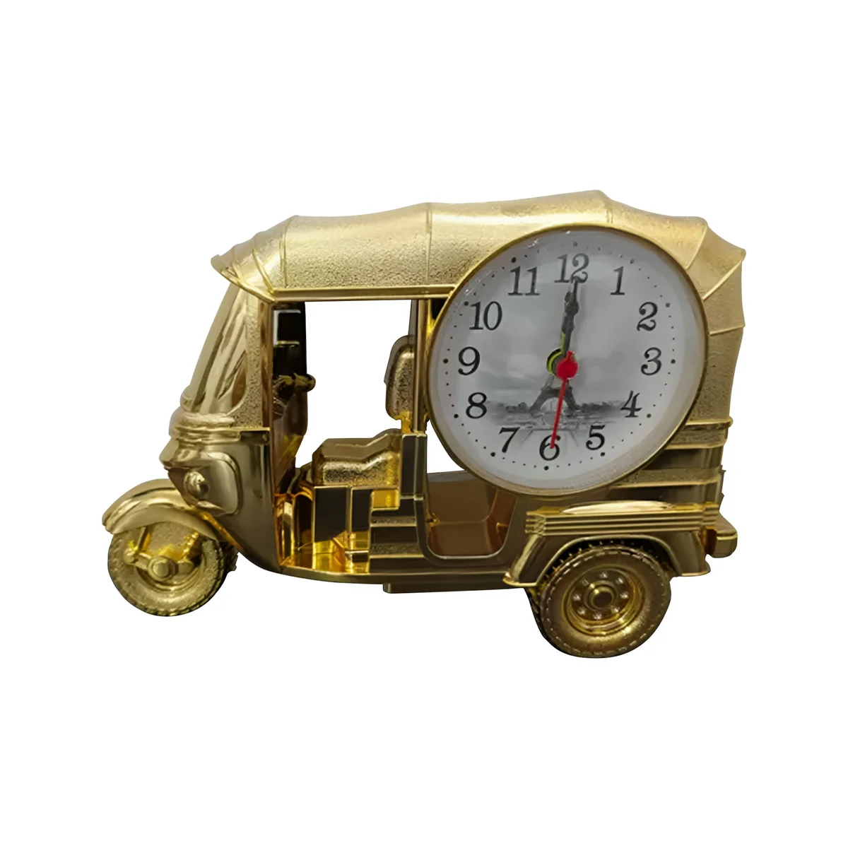 Modern three-wheeler plastic table clock in white, showing analogue dial with black numbers and hands on a desk surface