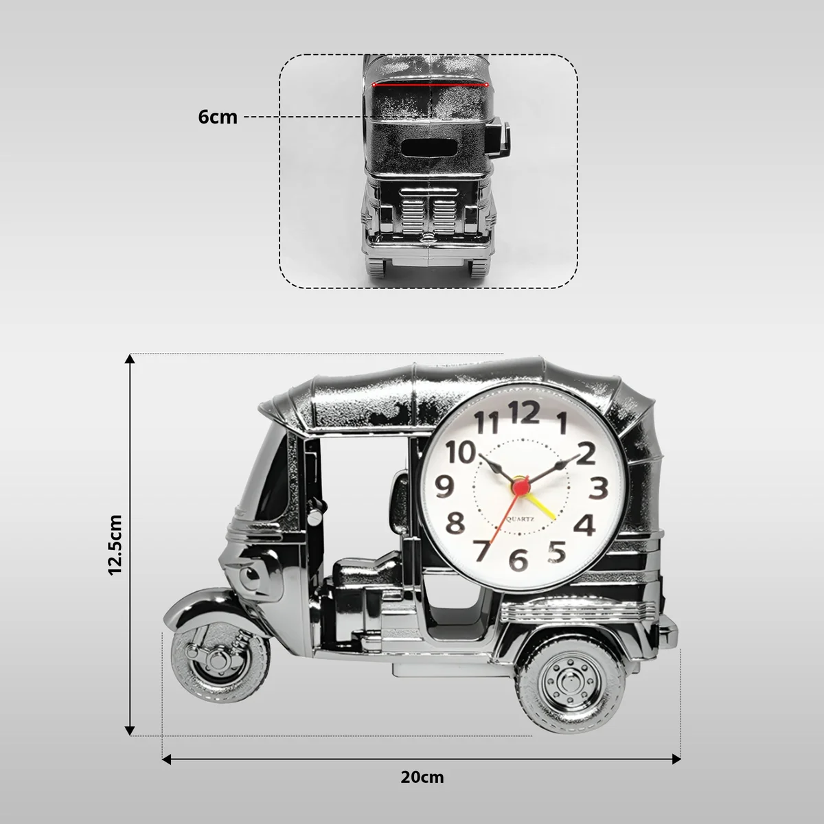Modern three wheeler clock in plastic with analogue display, shown on a wooden desk as a decorative alarm clock gift