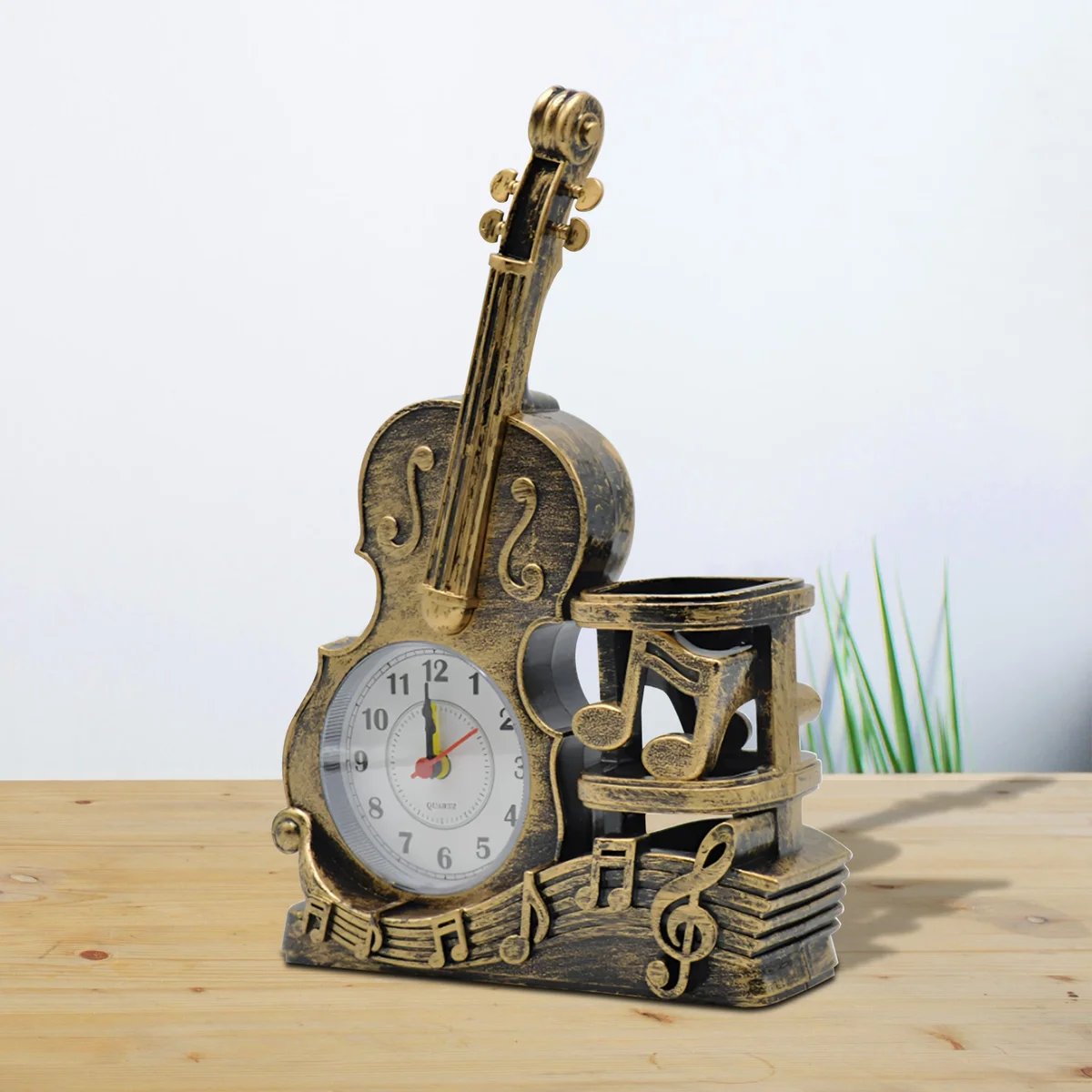 Vintage style violin alarm clock with integrated pen holder in French gold finish on white background