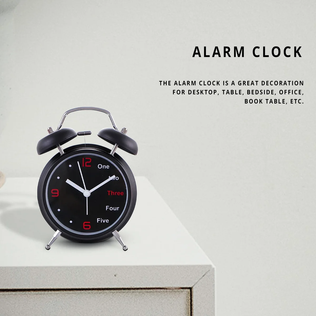 Retro alarm clock with twin metal bells, round face, black frame, white dial, and clear black numbers on a white background
