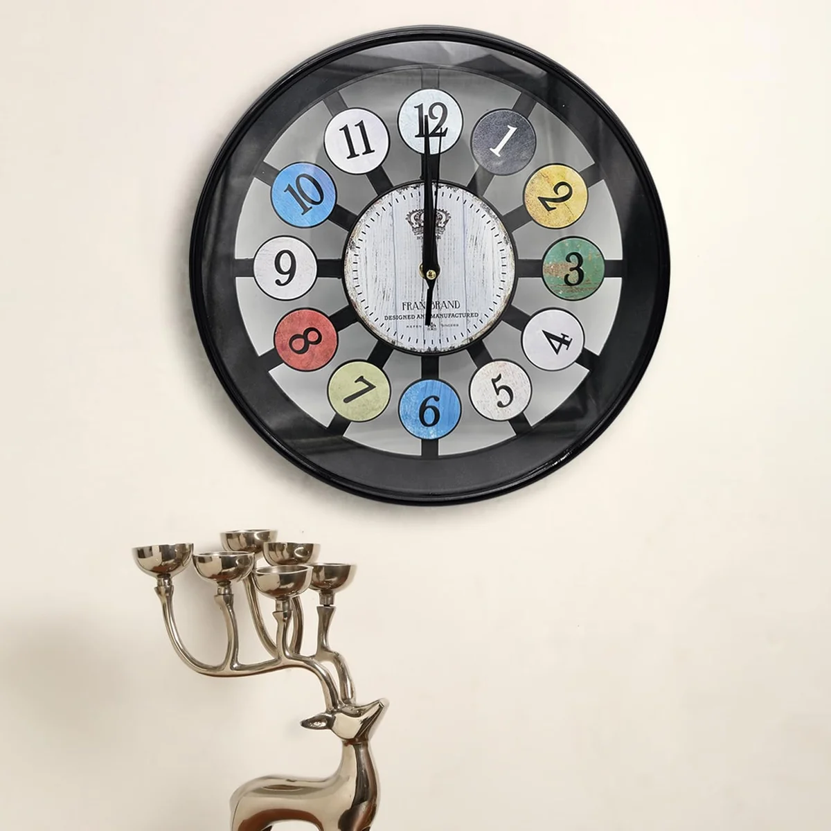 Round modern wall clock with colourful numbers on a tempered glass face and slim black frame, 30cm diameter.