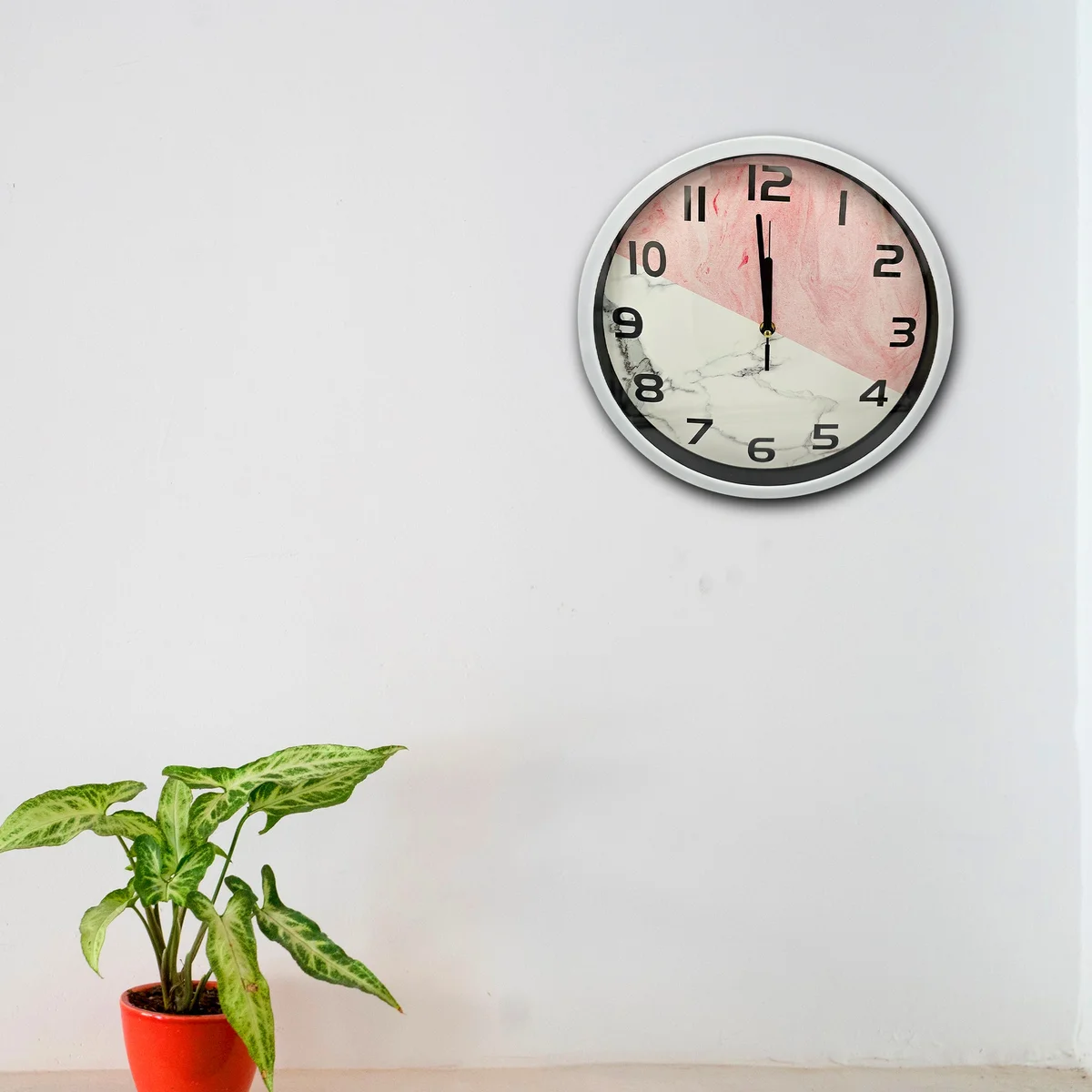 Round modern vintage wall clock with metal frame and easy-to-read analog display showing 10:10 on white face