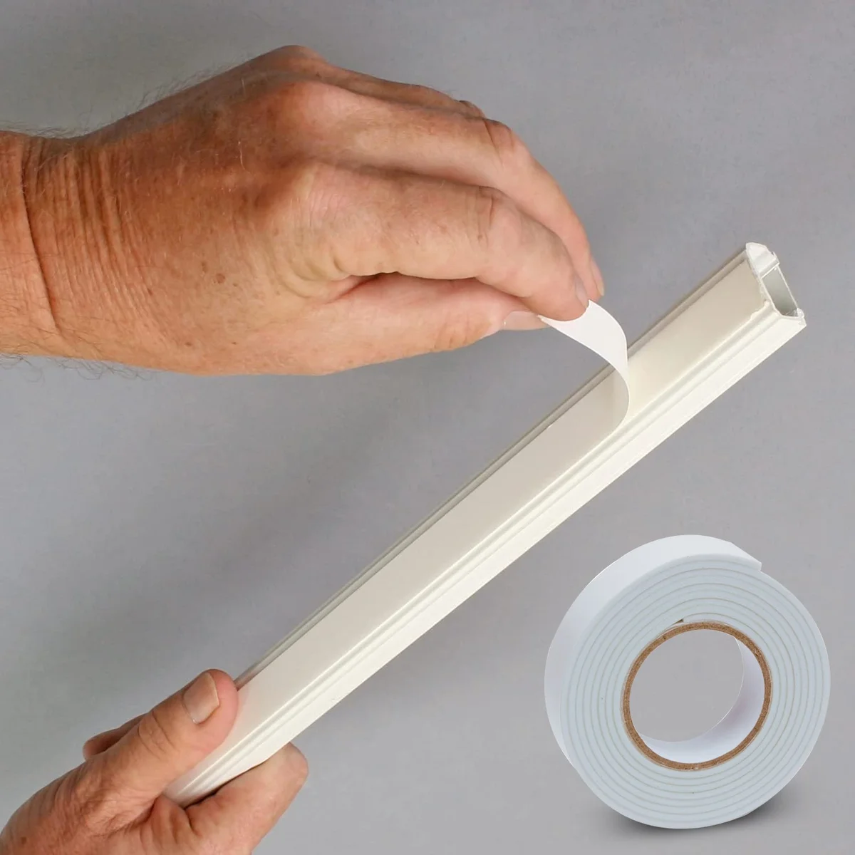Six white rolls of heavy duty waterproof eva foam adhesive tape stacked on a white background