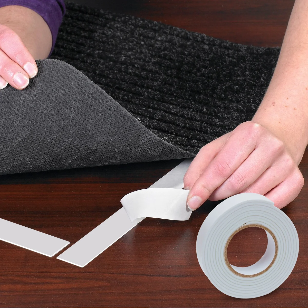 Close-up of white removable double sided tape rolls made from heavy duty waterproof EVA foam material, 6 pack shown