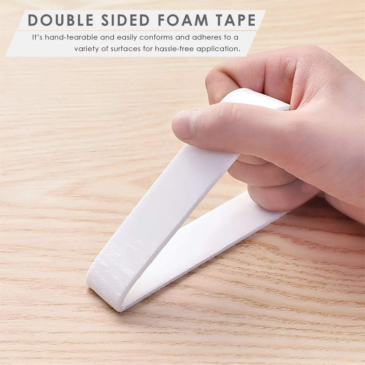 Six rolls of white heavy duty double sided tape made from EVA foam, stacked in two rows on a plain background