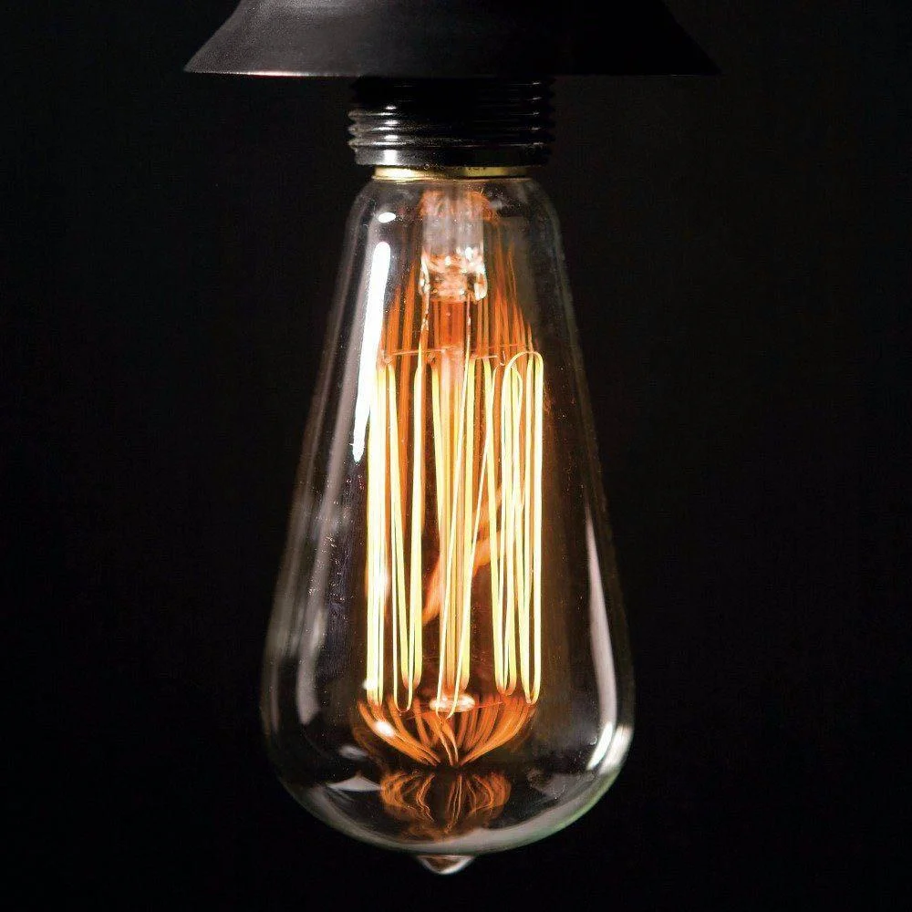Ten vintage ST64 E27 4W LED bulbs with visible filaments glowing warm white light on a plain background