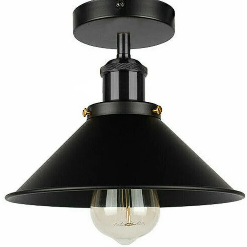 Black and yellow brass conical metal ceiling light mounted on a white ceiling above a kitchen sink area