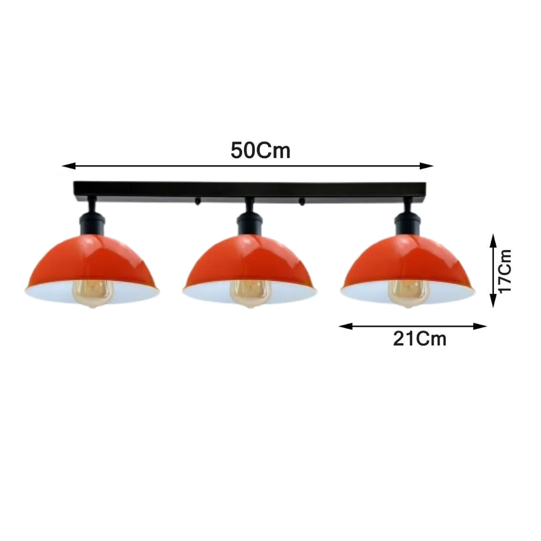 Industrial steam punk 3 way ceiling light with orange metal pipe design and three Edison bulb holders hanging indoors