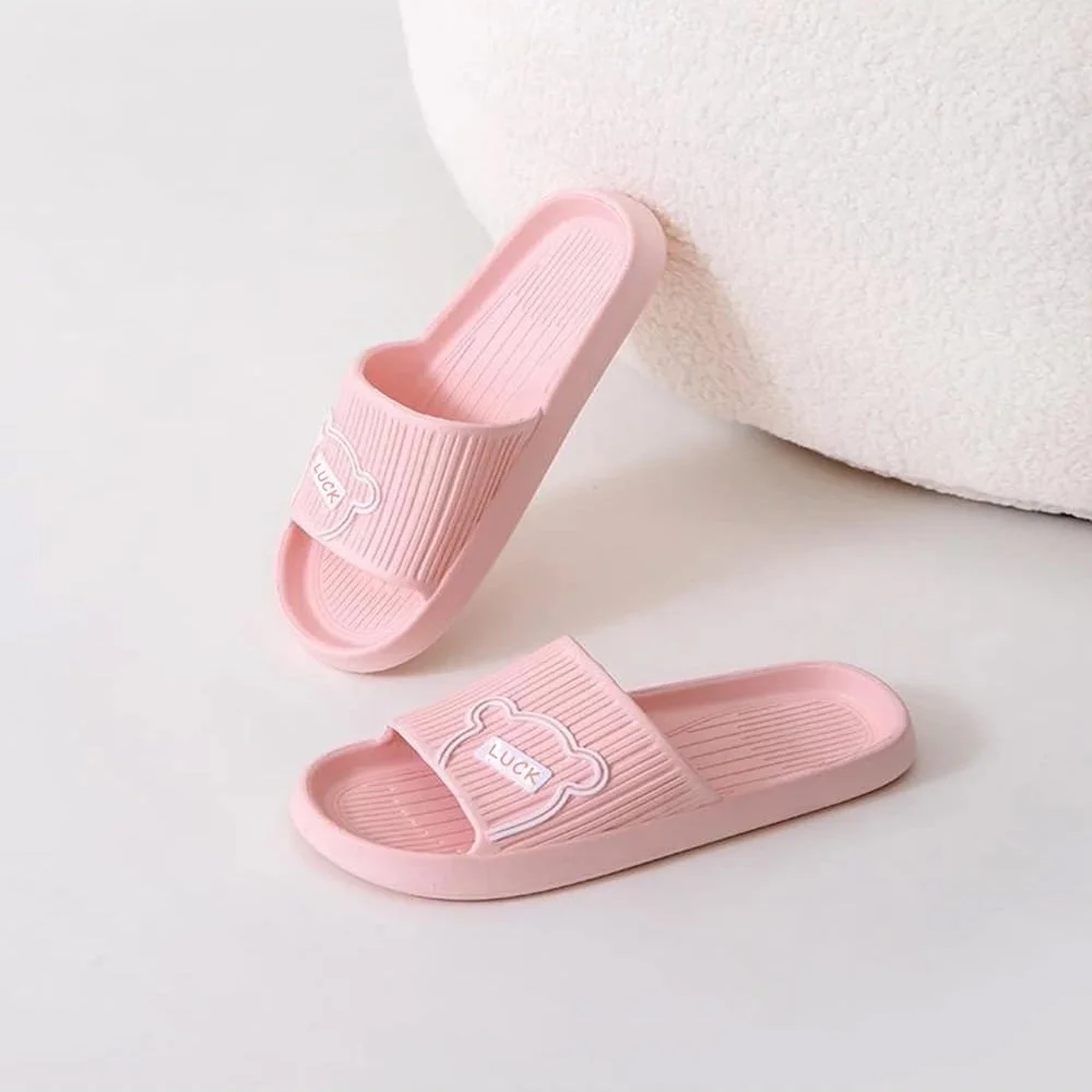 Pair of lightweight, non-slippery comfortable flip flops in black with ergonomic design and cushioned sole on white background