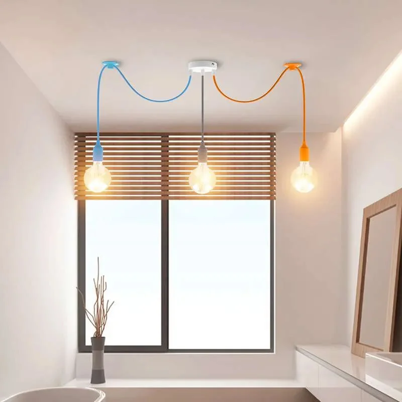 3-head industrial dimmable pendant light with orange, blue, and grey fabric cables hanging from ceiling rose