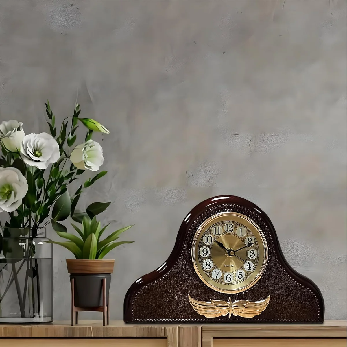 Leather Napoleon style decorative table clock with large black numbers on white face, leather accents, round design