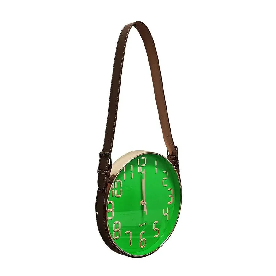 Modern wall clock with round concrete face and brown leather strap hanging on white wall background