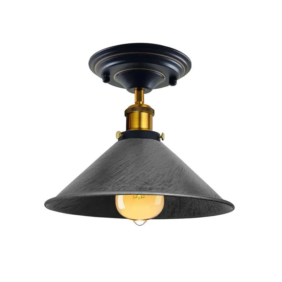 Vintage industrial pendant light with rust‑resistant metal cone shade, flush mount design in Yellow Brass.