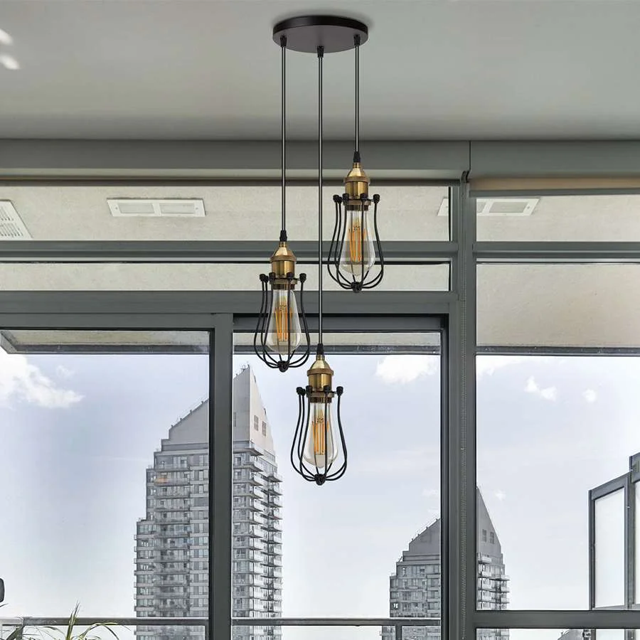 Black metal dimmable cluster pendant light with three wire bulb cages and adjustable 95cm cords hanging from ceiling rose