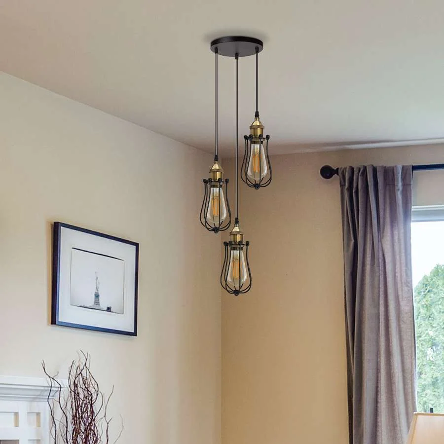 Black industrial cluster ceiling light with three adjustable wire bulb cages and 95cm cords hanging from ceiling rose