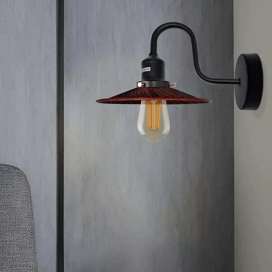 Industrial wall light with curved swan neck arm, metal finish, and E27 bulb mounted on a white wall