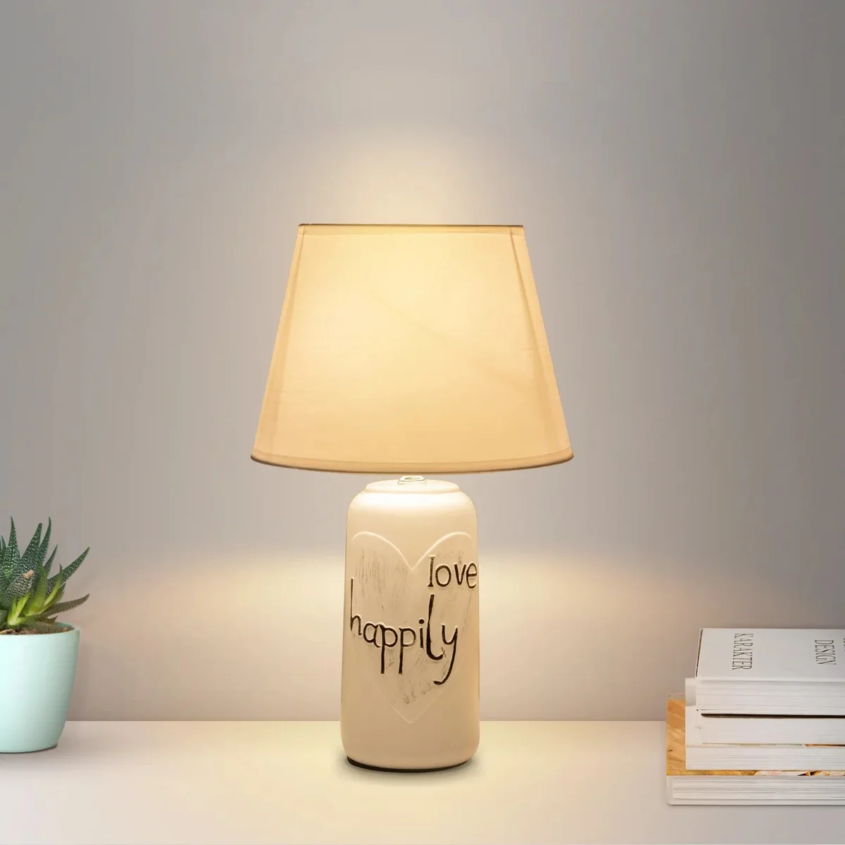 Elegant bedside table lamp with ceramic base and fabric shade, ideal for bedroom or living room lighting