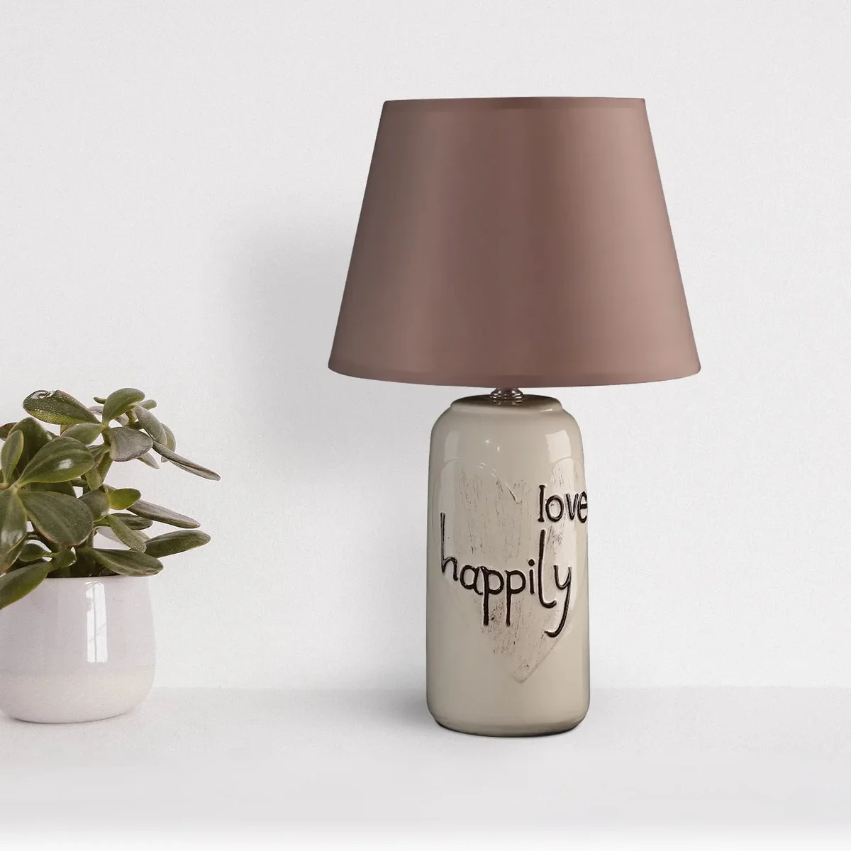 Elegant bedside table lamp with ceramic base and fabric shade, providing soft, warm light for bedroom or living room use