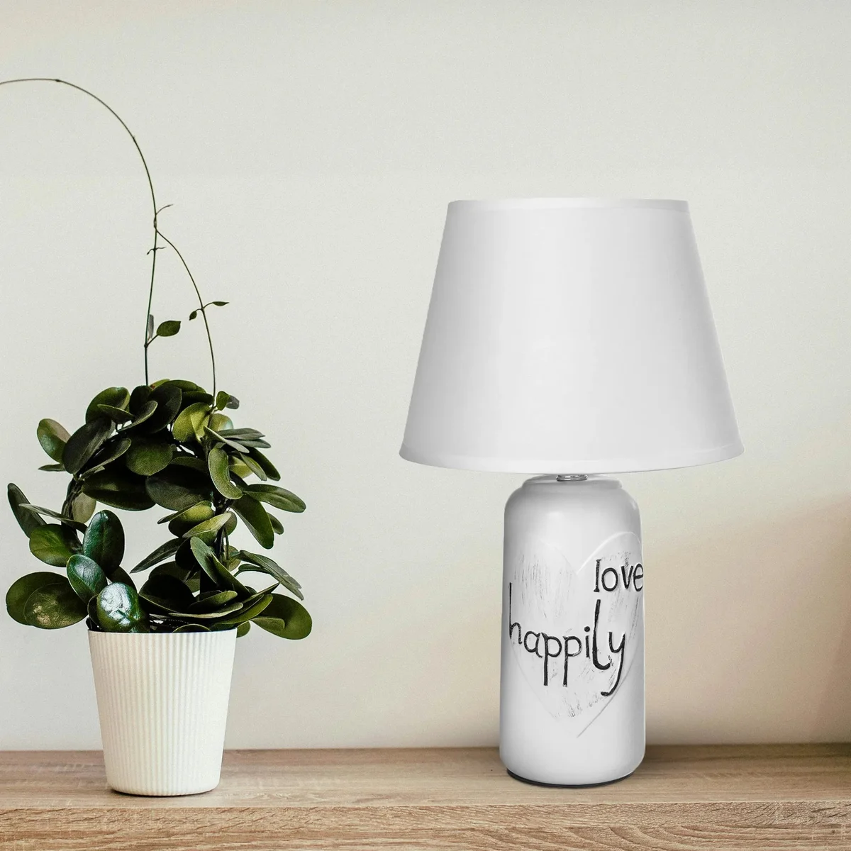 Elegant bedside table lamp with ceramic base and fabric shade, ideal for bedroom or living room lighting