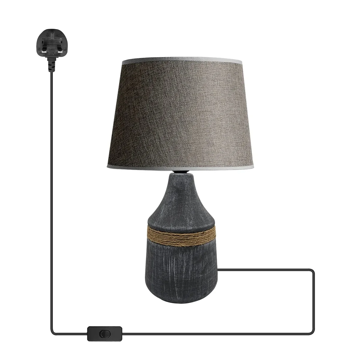 Black table lamp with ceramic base and fabric coolie shade on wooden surface against white background