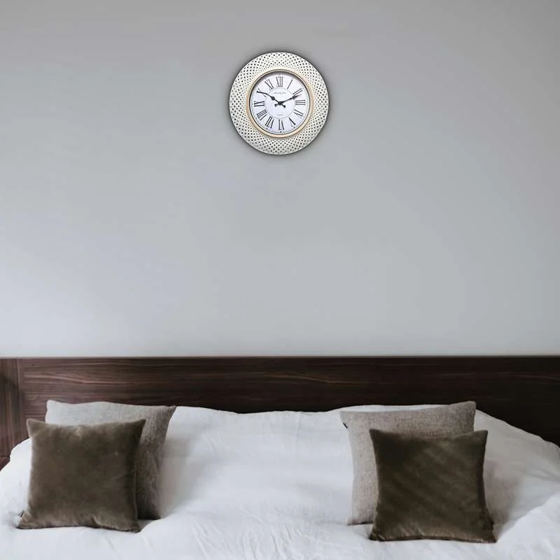 Retro round battery powered clock with Roman numerals and black hands on white background, plastic frame, 40.64cm diameter