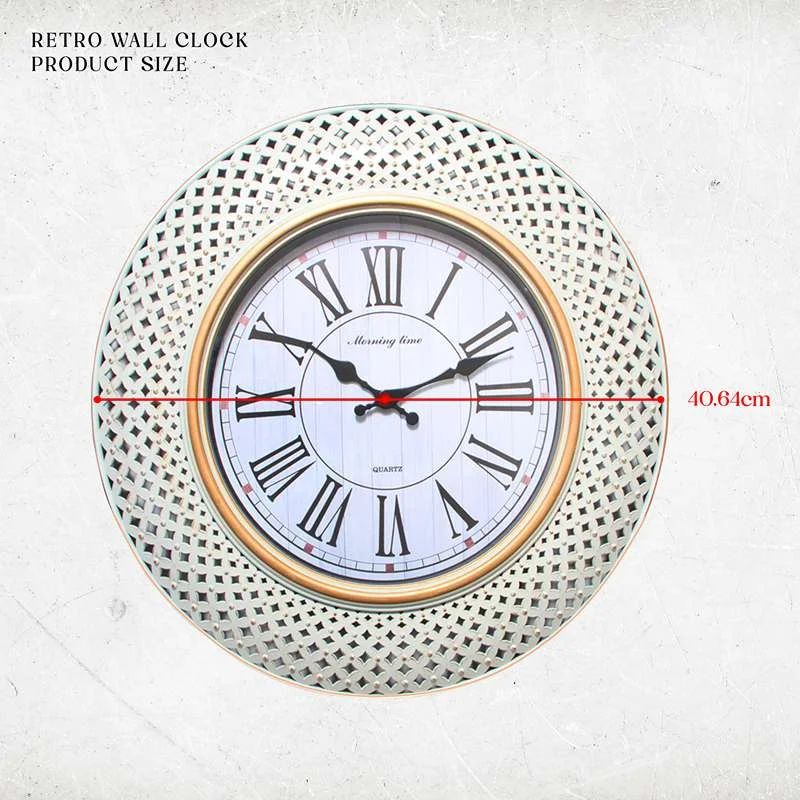 Retro wall clock with round shape, Roman numerals, black hands, and a sleek plastic frame on a white background