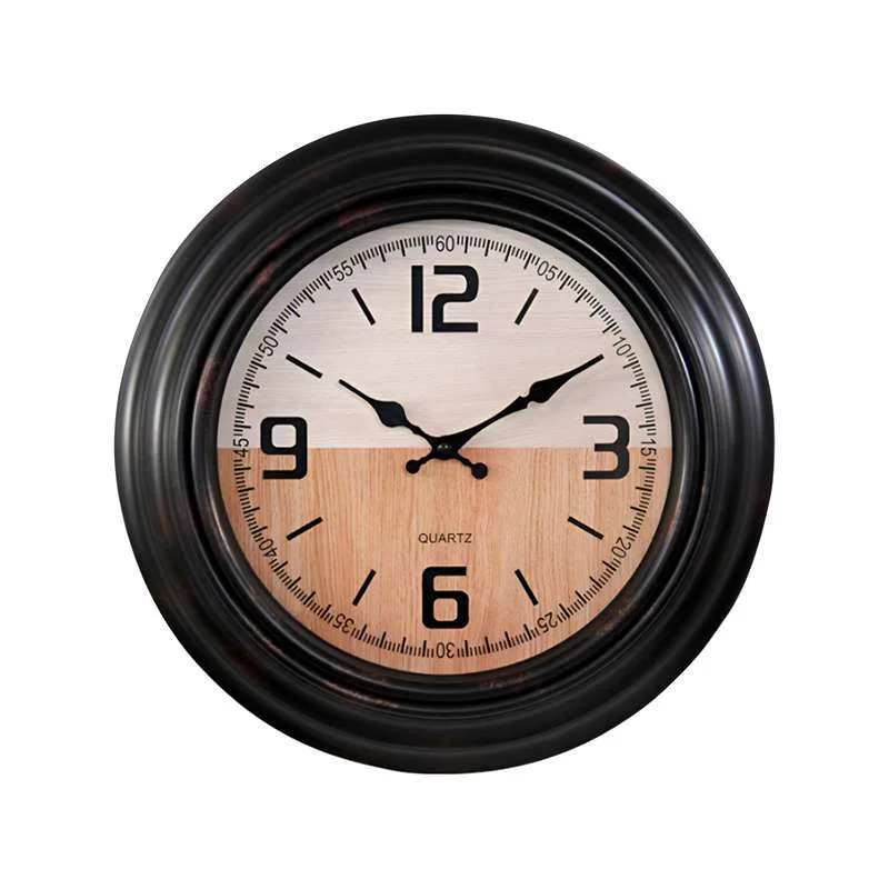 Black round vintage large battery powered clock with clear numbers and hands on a sleek plastic surface hanging on wall