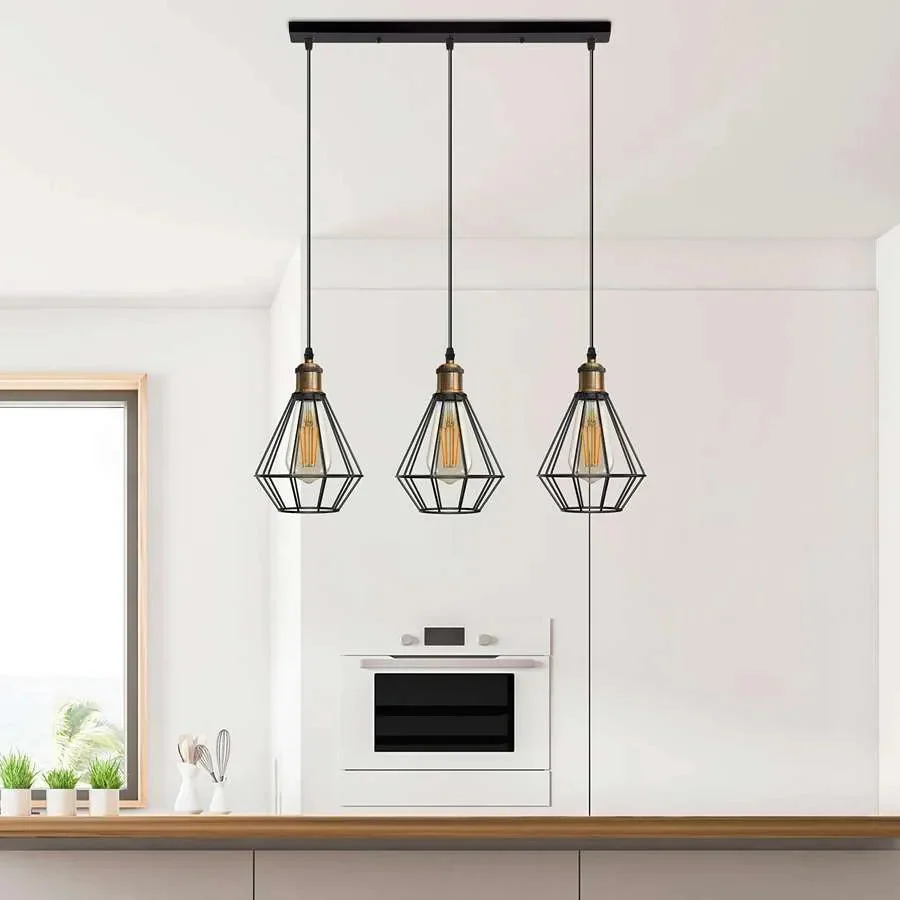 Black industrial style adjustable pendant light with three bulb guard wire cages hanging from ceiling rose